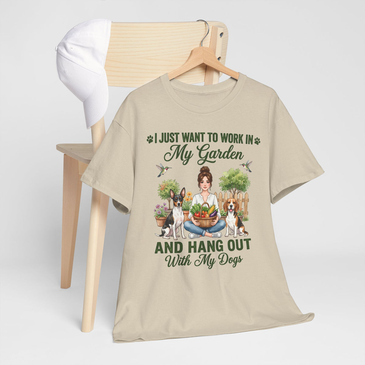 I Just Want to Work in My Garden and Hang Out With My Dogs Unisex T-Shirt — woman relaxes cross-legged in her garden
