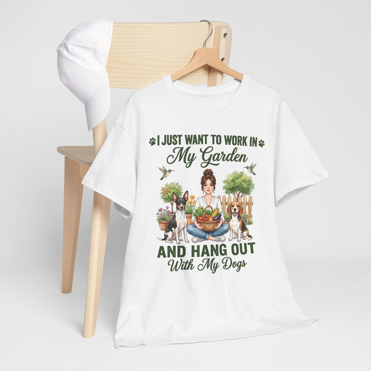 I Just Want to Work in My Garden and Hang Out With My Dogs Unisex T-Shirt — woman relaxes cross-legged in her garden