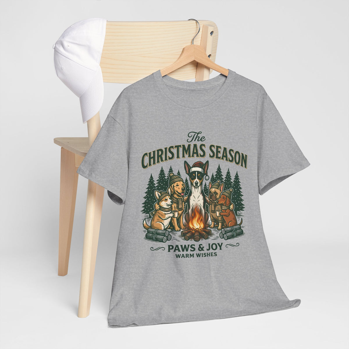 The Christmas Season Unisex T-Shirt — dogs settle in around a crackling campfire