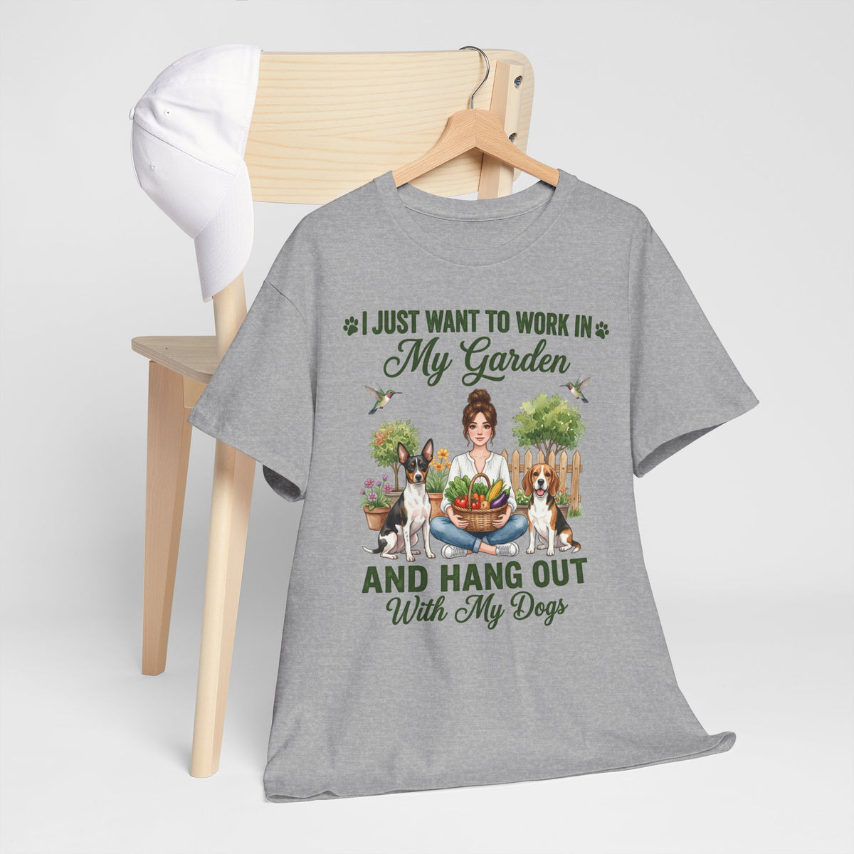 I Just Want to Work in My Garden and Hang Out With My Dogs Unisex T-Shirt — woman relaxes cross-legged in her garden