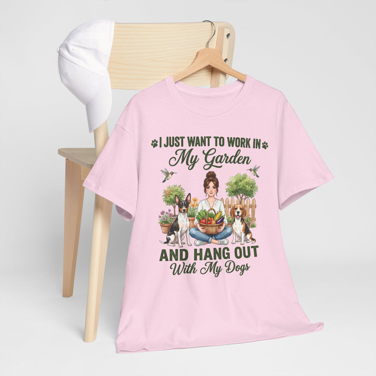 I Just Want to Work in My Garden and Hang Out With My Dogs Unisex T-Shirt — woman relaxes cross-legged in her garden
