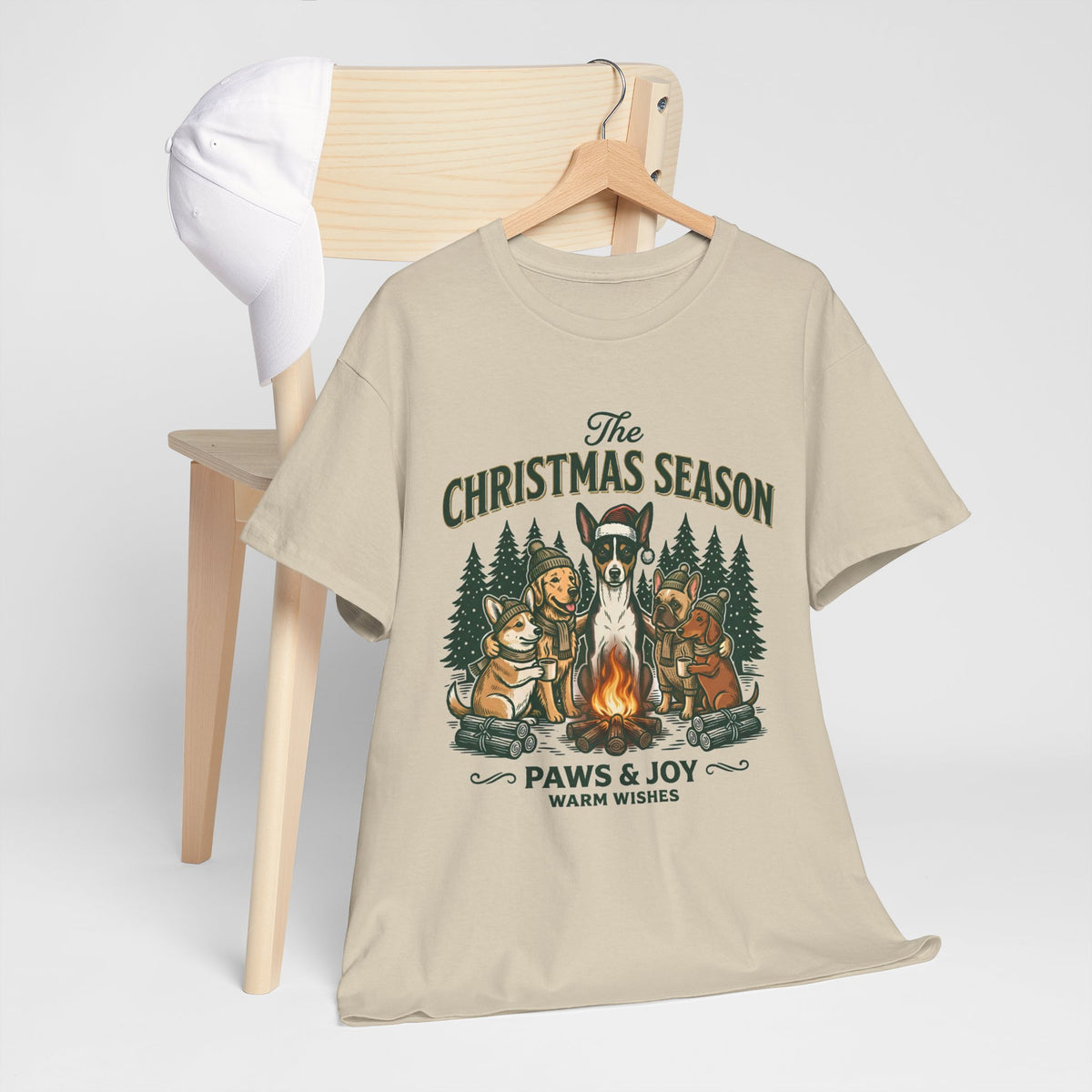 The Christmas Season Unisex T-Shirt — dogs settle in around a crackling campfire